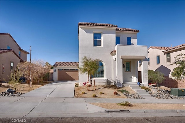 mediterranean / spanish home with a garage