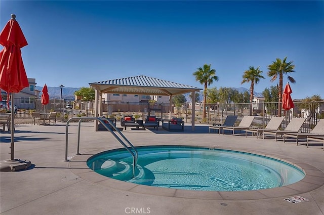 view of pool featuring a patio area and a gazebo