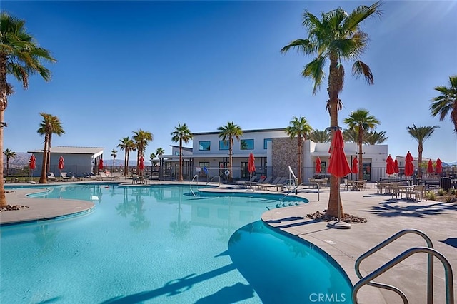 view of swimming pool with a patio