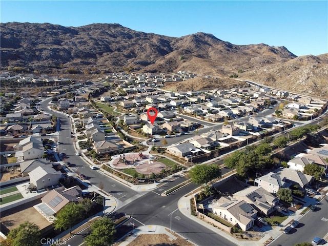 birds eye view of property with a mountain view