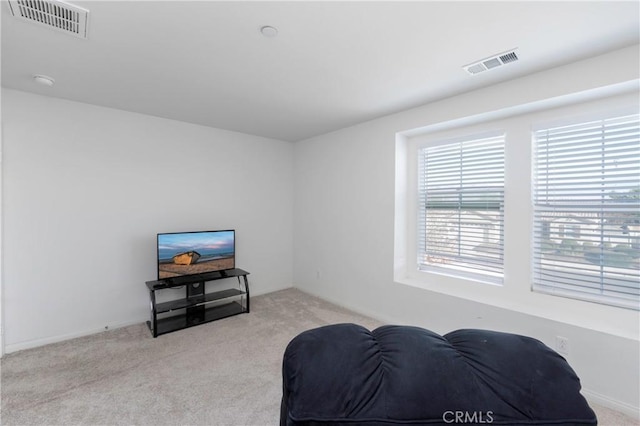 living area with light carpet