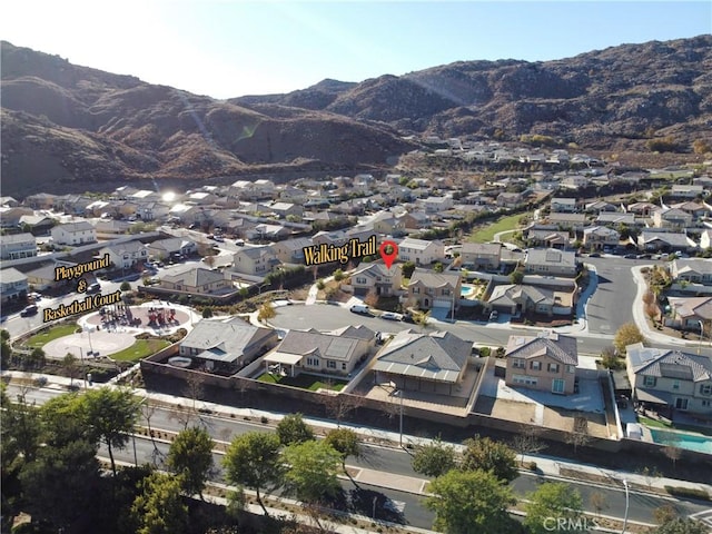 birds eye view of property featuring a mountain view