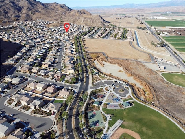 birds eye view of property featuring a mountain view