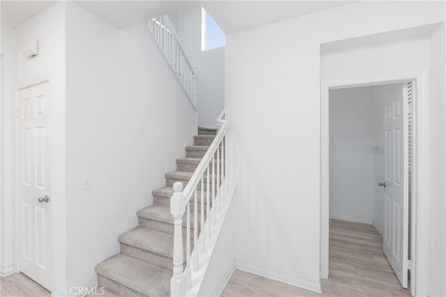 stairs with wood-type flooring