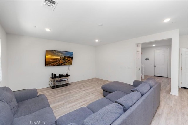 living room with light hardwood / wood-style flooring