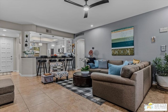 living room with ceiling fan