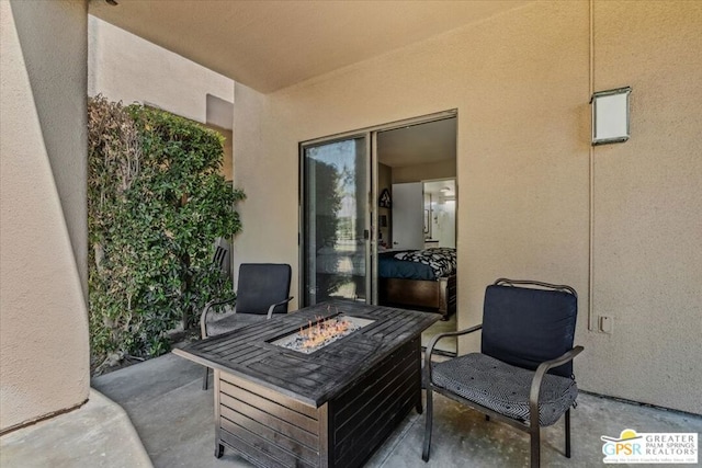 view of patio / terrace featuring a fire pit