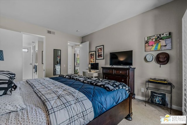 bedroom with light colored carpet and multiple windows