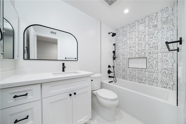 full bathroom featuring toilet, tiled shower / bath combo, and vanity