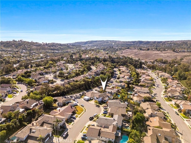 birds eye view of property with a mountain view