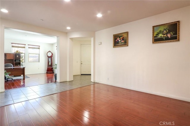 unfurnished room with wood-type flooring