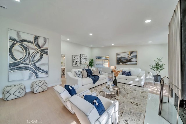 living room with hardwood / wood-style flooring and vaulted ceiling