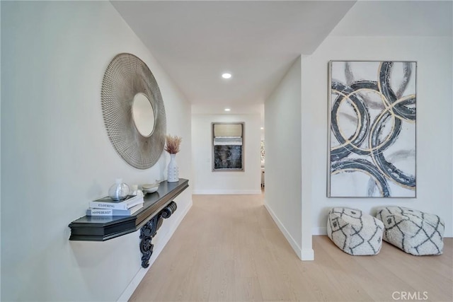 hall with light hardwood / wood-style flooring