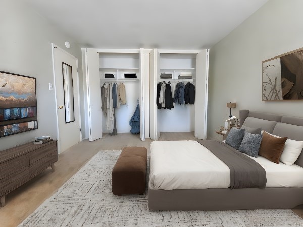 bedroom featuring multiple closets