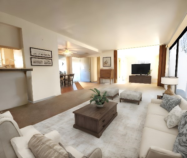 living room featuring a ceiling fan and carpet floors