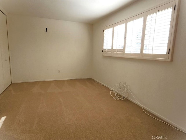 empty room with light colored carpet