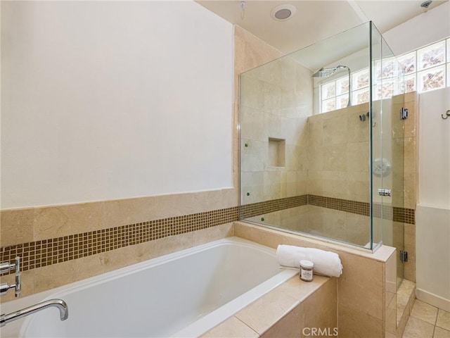 bathroom featuring separate shower and tub and tile patterned flooring