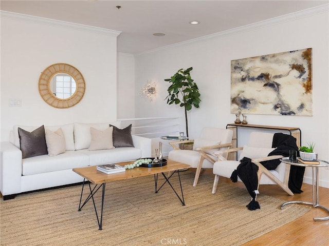 living room with hardwood / wood-style flooring and ornamental molding