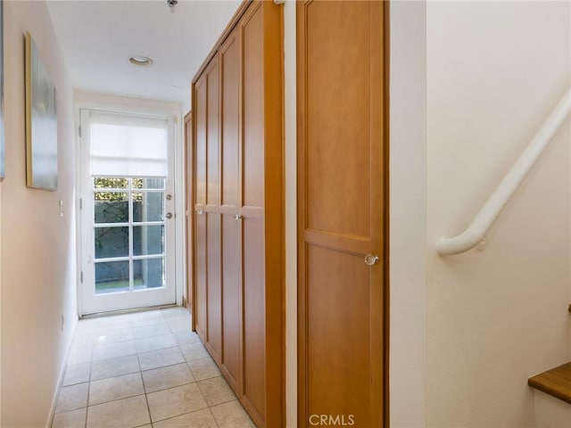 corridor with light tile patterned floors