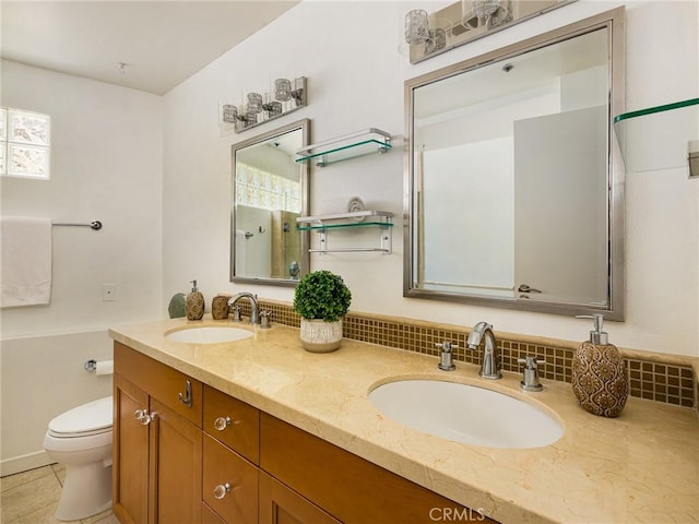 bathroom with toilet, tile patterned flooring, backsplash, and vanity