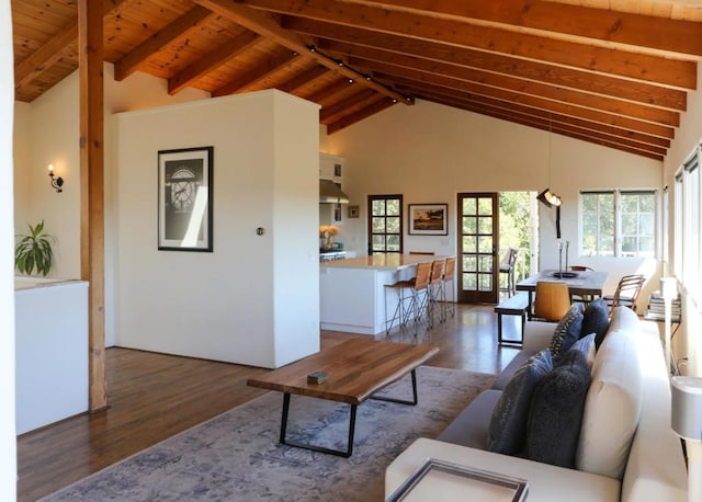 living room with beamed ceiling, wood ceiling, dark hardwood / wood-style floors, and high vaulted ceiling