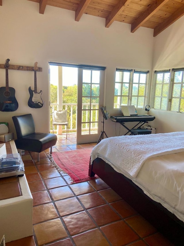 bedroom with access to exterior, beamed ceiling, wood ceiling, and tile patterned flooring