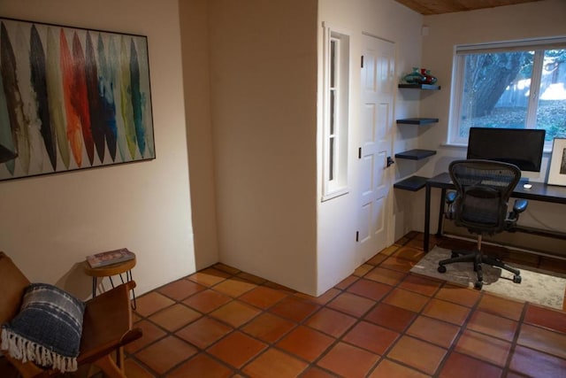 home office with tile patterned floors