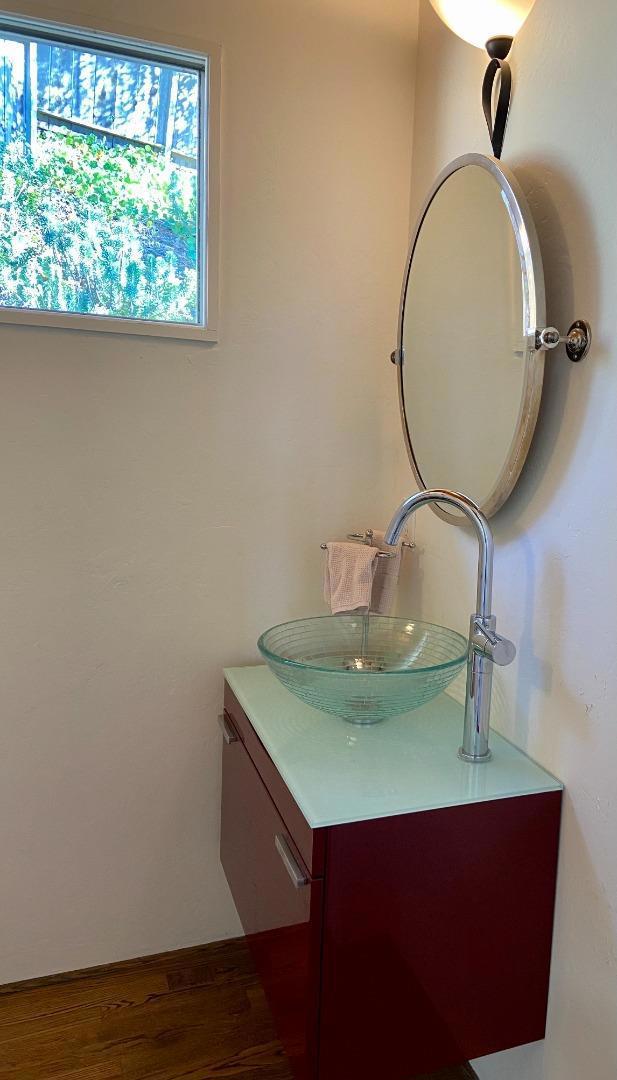 bathroom featuring wood-type flooring and vanity