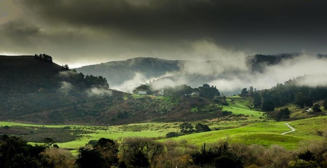 property view of mountains featuring a rural view