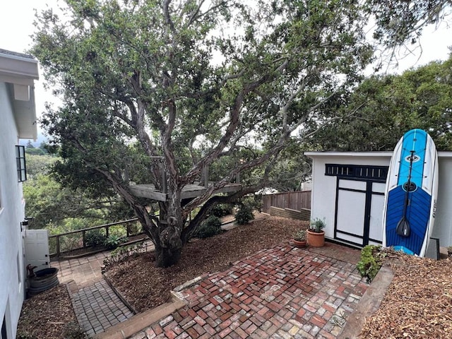 view of patio featuring a shed and cooling unit