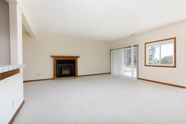 unfurnished living room featuring light colored carpet