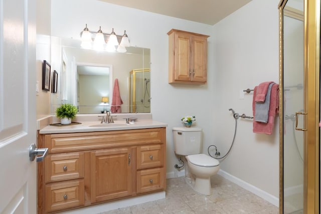 bathroom with toilet, a shower with shower door, and vanity