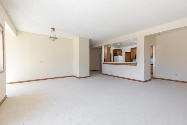 unfurnished living room with light carpet