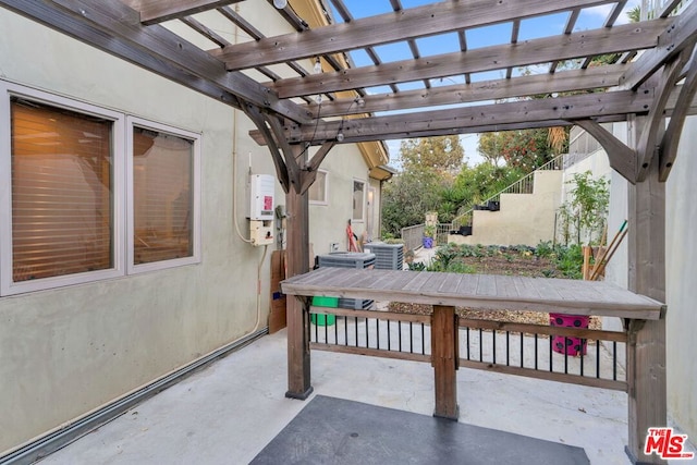 view of patio with a pergola and central AC