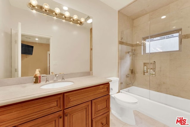 full bathroom with toilet, tile patterned flooring, enclosed tub / shower combo, and vanity