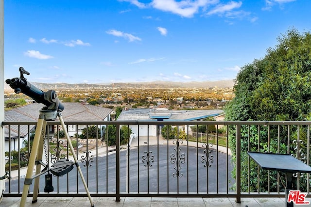 balcony featuring a mountain view