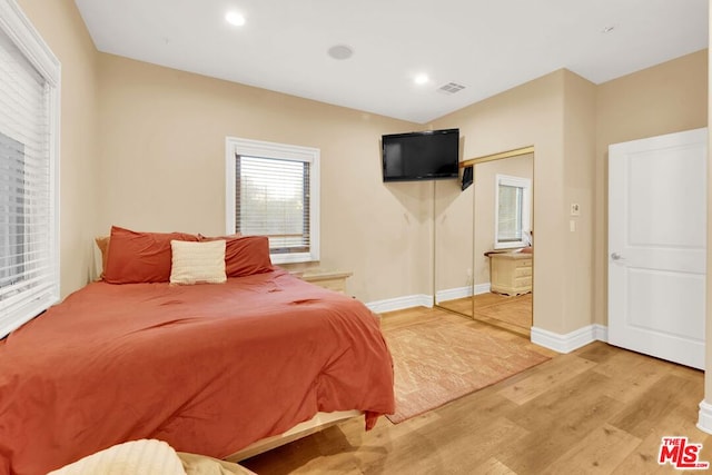 bedroom featuring a closet and hardwood / wood-style flooring