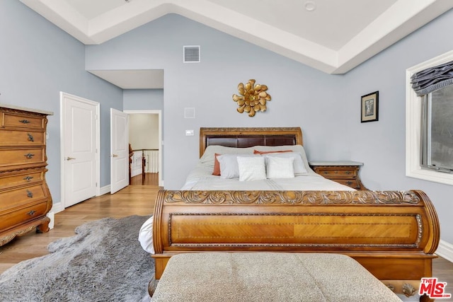 bedroom with hardwood / wood-style flooring