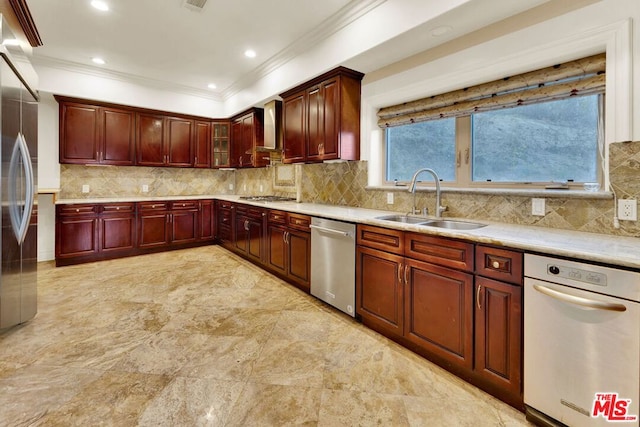 kitchen with appliances with stainless steel finishes, wall chimney exhaust hood, tasteful backsplash, crown molding, and sink