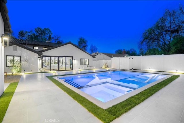 view of swimming pool featuring an in ground hot tub and a patio