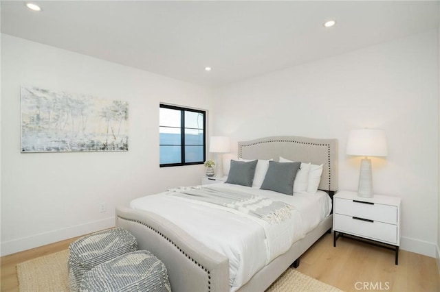 bedroom with light hardwood / wood-style floors