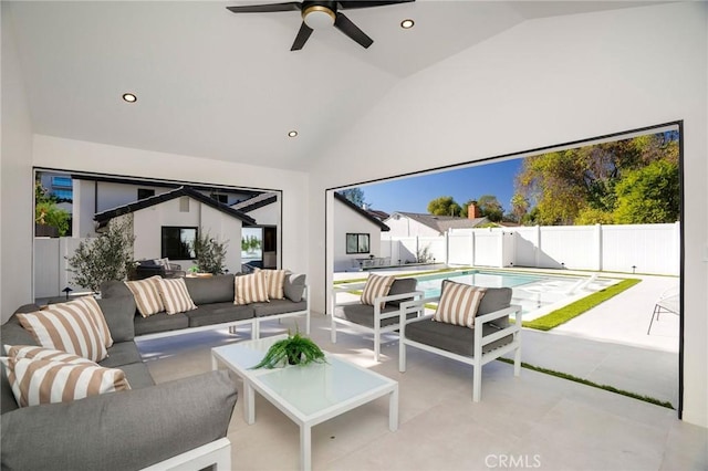 interior space featuring ceiling fan, an outdoor living space, and a fenced in pool