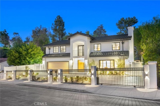 mediterranean / spanish house featuring a garage