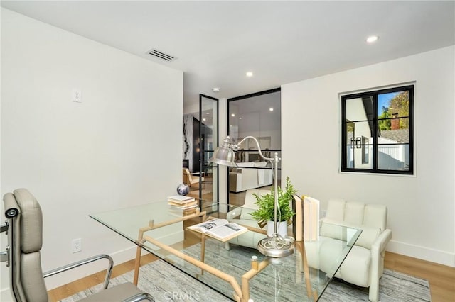 home office featuring hardwood / wood-style floors