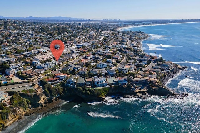 birds eye view of property featuring a water and mountain view