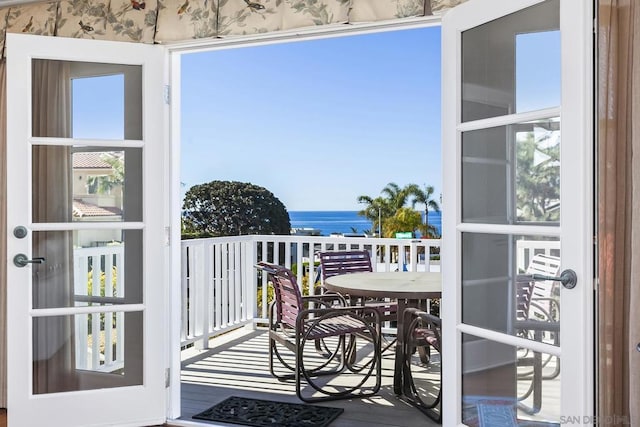 balcony featuring a water view