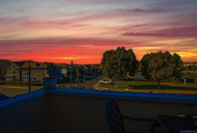 view of pool at dusk