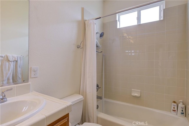 full bathroom with toilet, vanity, and shower / tub combo