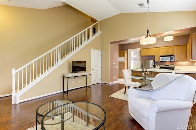 living room with vaulted ceiling and dark wood-type flooring