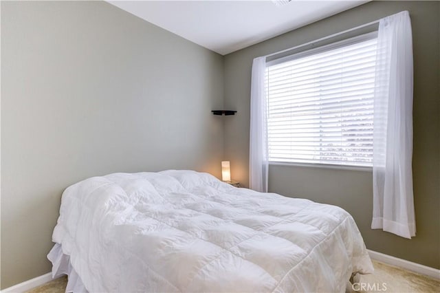 bedroom featuring carpet